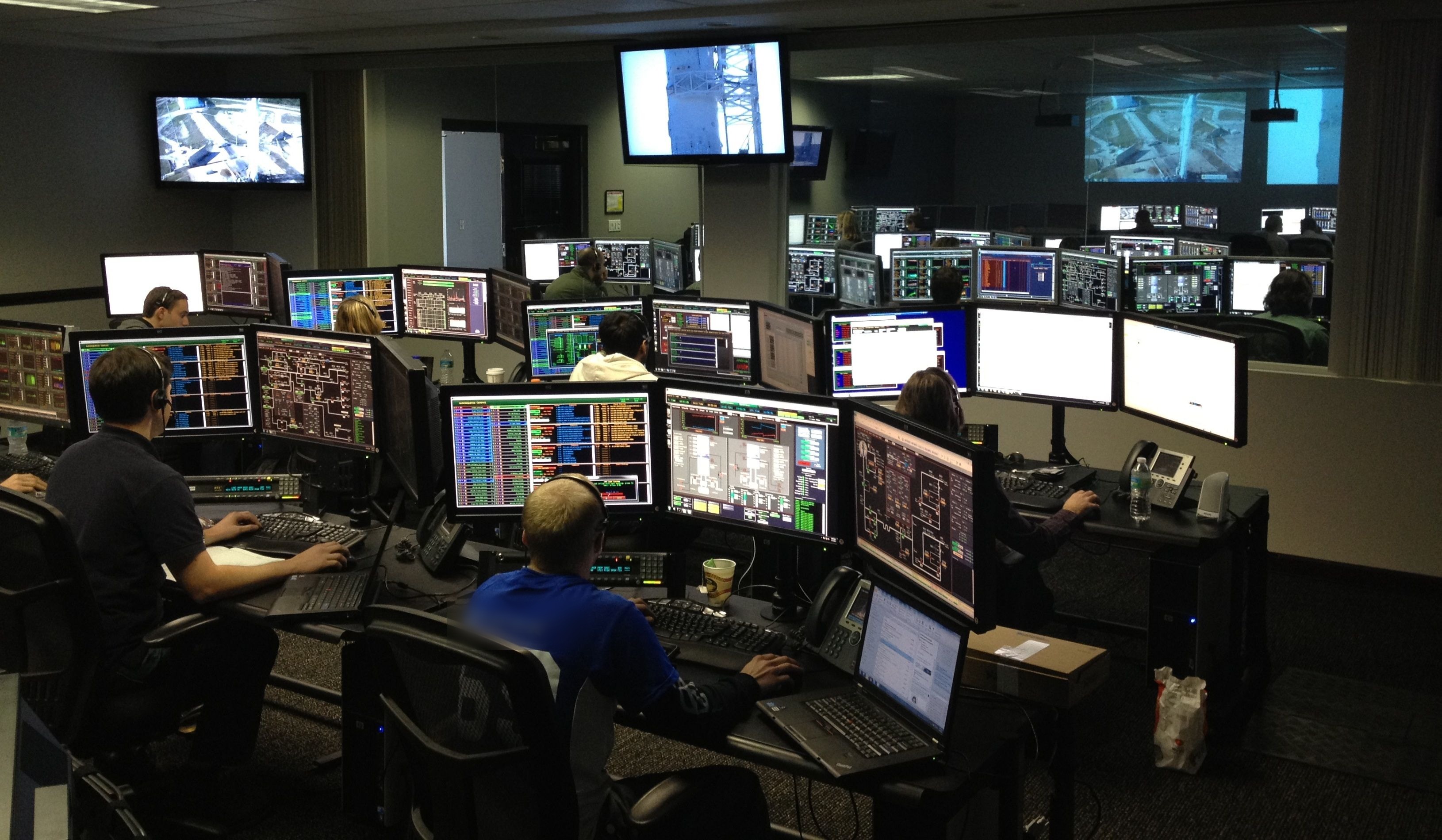 IT technician working in a data center server room